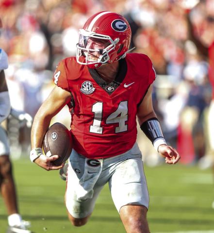 Stockton rushes past Ole Miss defenders for a touchdown last season. LANCE McCURLEY/Staff