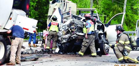 Three men died after the pickup truck they were in crashed into the left rear of a tractor-trailer stopped for a traffic light on Hwy. 441 at Twin Bridges Road in Putnam County. IAN TOCHER/Staff