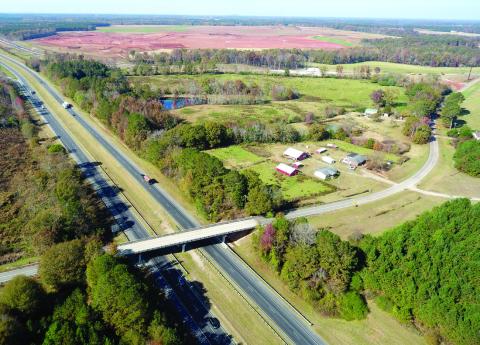 Rural landowners continue to work to preserve the agricultural lifestyle in the area of the new Rivian EV manufacturing plant along I-20 on the Morgan-Walton county line. The dirt in the background stands in contrast to farms located in the area. MARK ENGEL/Staff