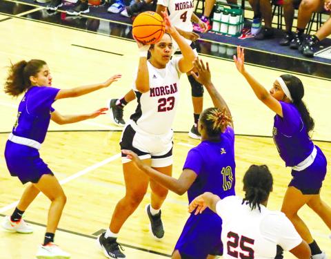 Senior Destiny Hunter (24) shoots a jumper over an ARC defender in Morgan County’s 60-31 rout of the Lady Musketeers last Tuesday. LANCE McCURLEY/Staff