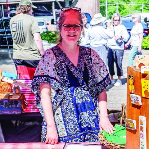 Festival Hall Executive Director Nicole Chillemi sells her tiny art.