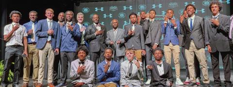Members of Morgan County’s 2026 GHSA 2 AA championship-winning boys basketball team show off their title rings July 27, during a ceremony in the school’s auditorium. SKYLA MORRIS/Staff