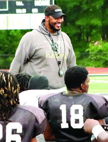 New Greene County head coach Darius Robinson talks with his team during a recent spring practice. COURTESY OF MOMMA D’S PIX