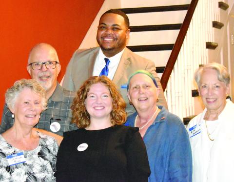Lexy Doherty, Democratic candidate for the U.S. House of Representatives District 10 seat, visited Morgan County residents at a meet-and-greet in Madison on Aug. 18. She met several members of the Morgan County Democratic Committee. Pictured (bottom row, l-r): Deneice Rice, Doherty, committee chair Jeanne Dufort, and Ruth Bracewell, with (top row) committee secretary Brad Rice and Artez Kelley. (HANNAH BARRON/Staff)