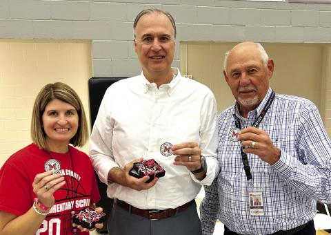 L-R: Chelsea Hayes, Dr. Virgil Cole, and Dr. Dennis Fordham received service coins during Morgan County Charter School’s End-of-Year Celebration for their contributions to the school system. CONTRIBUTED