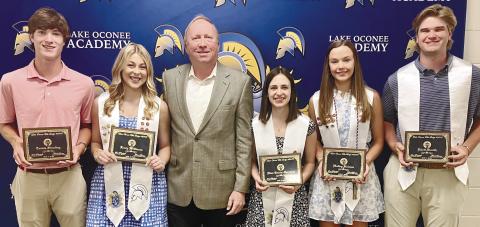 Lake Oconee Academy scholarship recipients, from left: Travis Shurling, Lucy Williams, Frank Rowan (Elks Lodge Scholarship Chair), Elisa Garcia-Carreras, Hailey Heinen and Rhett Smith. CONTRIBUTED