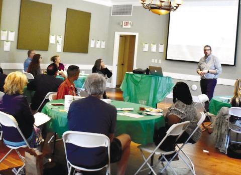 GaFCP Regional Manager Adam Swymer tells the Putnam County audience about summer plans. LENA HENSLEY/Staff