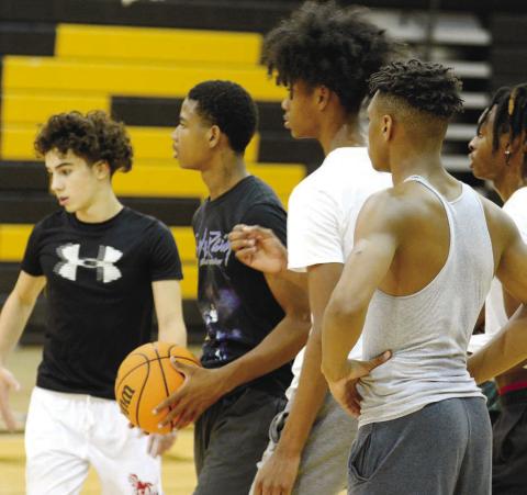 A group of Greene County basketball players waiting for their turn to complete a drill set up by head coach Mark Wright at p ractice earlier this week. BRENDAN KOERNER/Staff