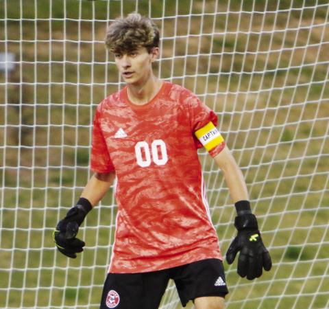Morgan County boys’ senior goal keeper Blake Downs gets ready for a play during a match against Apalachee on April 1. LANCE McCURLEY/Staff