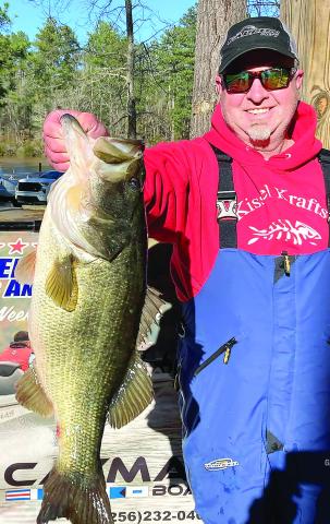 Aaron Batson with a hawg from Sinclair in the cold muddy water. CONTRIBUTED