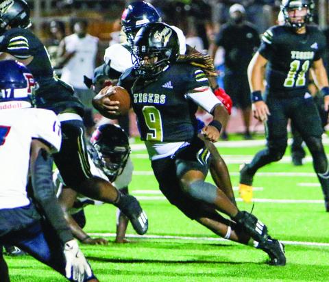 Armari Durham (9) rushed for 769 yards and 10 touchdowns last season as a senior for the Tigers. LANCE McCURLEY/Staff