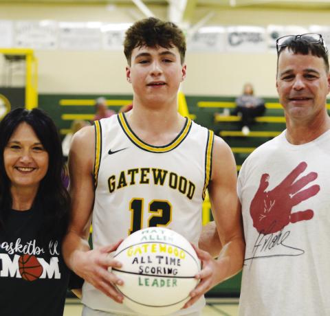 Matt Allen posed with his parents, April and Mark Allen, last Saturday after scoring his 1,665th point to become the all-time top scorer for Gatewood. IAN TOCHER/Staff