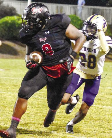 Tight end Antavious Elder (8) runs down the field as an Academy of Richmond County defender chases after him. LANCE MCCURLEY/Staff