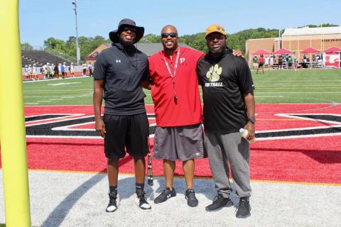 Greene County head coach Terrance Banks (right) poses for a photo of current Atlanta Falcon Grady Jarrett (left).