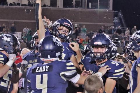 The Trojans celebrate their third straight title last December at Five-Star Stadium in Macon. ARELLA CASH/Staff