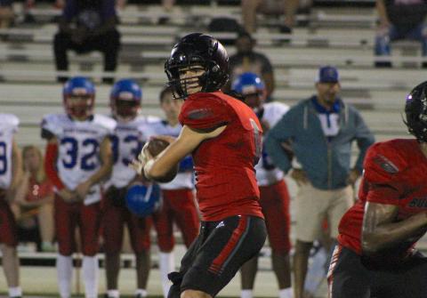 Tyler Saunders drops back to pass against Montgomery County in a scrimmage last week. CONTRIBUTED