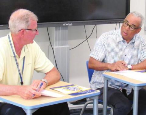 LOA CEO Otho Tucker (left) talks with LOA Board Vice Chairman Michael Tompkins (right) at the LOA Board of Governors meeting in June. MARK ENGEL/Staff