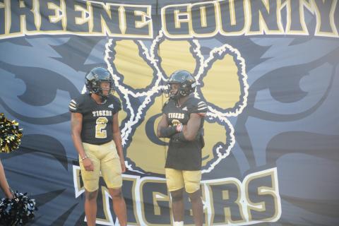 The Greene County Tigers get set to run through their banner before the scrimmage against Putnam County. BRENDAN KOERNER/Staff