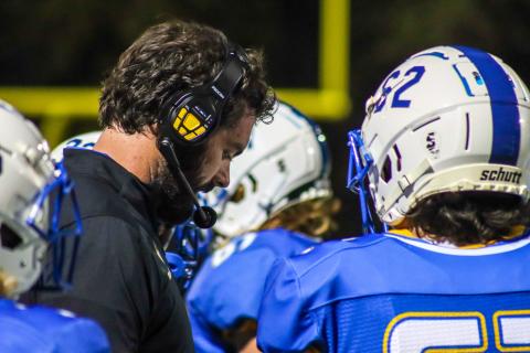 Lake Oconee Academy head coach Patrick Stewart talks to his players during a timeout in a game against Cherokee Christian earlier this season. LANCE MCCURLEY/Staff
