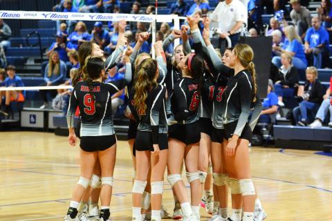 The Spike Dogs huddle during the Class AAA state title match against Oconee County. BRENDAN KOERNER/Staff