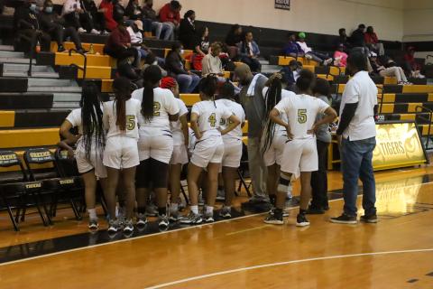 The Lady Tigers gather during a timeout in a game last season. LANCE MCCURLEY/Staff