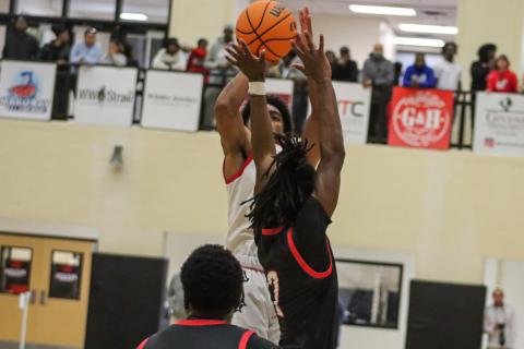 Morgan County's Reggie Ross (5) attempts a shot over Social Circle's Dashon Hyman (2). LANCE MCCURLEY/LANCE