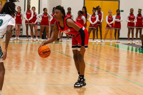 Morgan County freshman Brandon Nelson (13) dribbles the ball at the top of the key. LANCE MCCURLEY/Staff