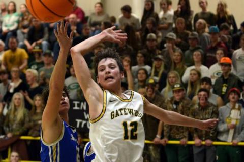Gatewood freshman Matt Allen (12) swats away a Brentwood guard's layup last Friday. IAN TOCHER/Staff