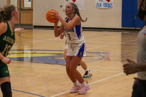 LOA junior Georgia Bosart (3) lines up a shot from beyond the arc in a win over Aquinas last Friday. LANCE MCCURLEY/Staff