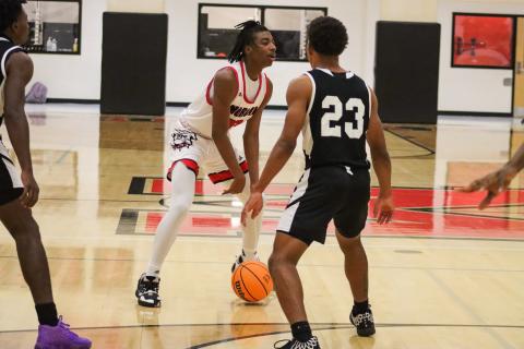 Bulldog freshman Brandon Nelson (13) brings the ball up the court against Hephzibah in a 66-51 loss on Tuesday, Jan. 31. LANCE MCCURLEY/Staff