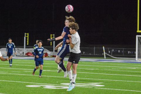 Bulldog senior Mckaylan Williams (right) goes up for a header against a Wildcats' defender. LANCE MCCURLEY/Staff