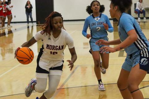 Morgan County junior Kiwi Lane (10) in transition trying to get past a Long County defender in last week's first-round win. LANCE MCCURLEY/Staff