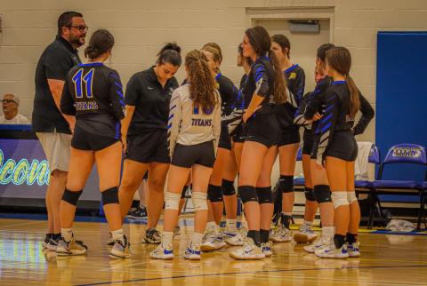 Lady Titans' head coach Chris Ingle talks to his team during a timeout in a region match against Washington-Wilkes last season. LANCE MCCURLEY/Staff