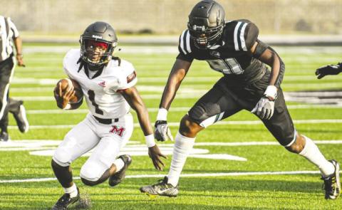 Morgan County running back Jay Dorsey (1) breaks away from a Walnut Grove defender during a scrimmage against the Warriors in May. CHARLES JORDAN/Staff