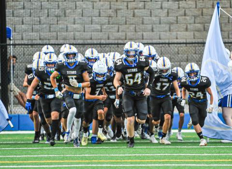 The Titans take the field last week before their scrimmage against Lakeview Academy. CHARLES TURNER/Contributed