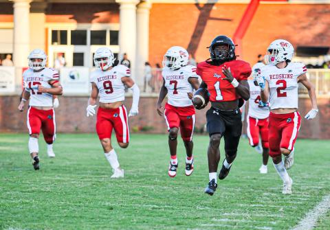 Jay Dorsey (1) runs away from Social Circle defenders on his first touchdown run of the night. CHARLES JORDAN/Contributed