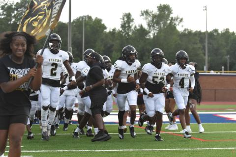 The Greene County Tigers take the field against Putnam County for a scrimmage at Al Reaves Field last Friday. BRENDAN KOERNER/Staff