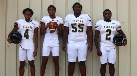 Greene County football players (From L to R): Chris Lowe (4), Steve Miller (3), Kevin Wynn (55), and Justin Hill (2) will be the leaders of the team this year. BRENDAN KOERNER/Staff
