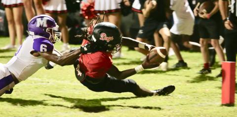 Morgan County senior running back Jaydon Dosey dives for the pylon trying to score. JIM TURNER/Contributed