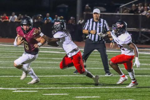 Gavin Hall, who is now at Gainesville, runs away from Morgan County's Jaydon Dorsey (1) in Hebron Christian 35-28 win over Morgan County last year. LANCE MCCURLEY/Staff