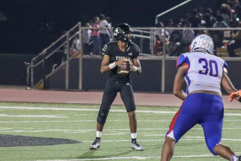 Greene County quarterback Steve Miller stares down an Oglethorpe County defensive lineman during a game last season in Greensboro. LANCE MCCURLEY/Staff