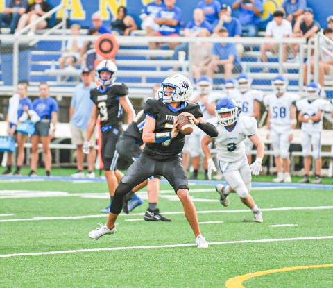 Titans' quarterback Ike O'Neal gets set to launch a pass downfield against Towns County earlier this season. CHARLES JORDAN/Staff