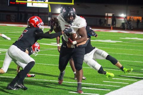 Morgan County senior tight end Antavious Elder (8) rumbles past Harlem defenders. LANCE MCCURLEY/Staff