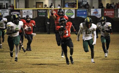 Bulldog senior running back Jay Dorsey (1) breaks off a long run for a touchdown in the fourth quarter last Friday against Monroe. TREY NORRIS/Staff