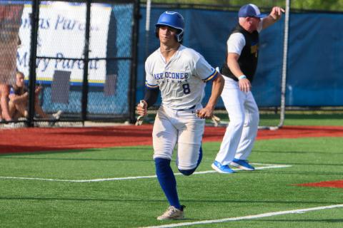 Cameron Kelley (12) races home to score in a recent win over Aquinas. LANCE MCCURLEY/Staff