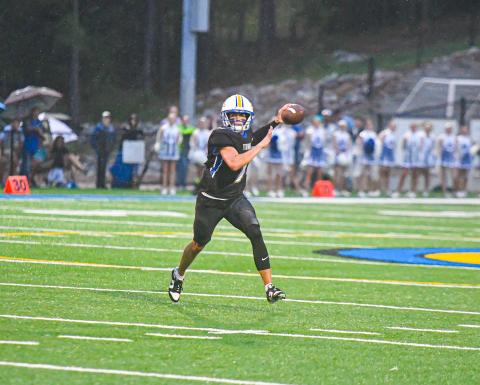 Lake Oconee Academy senior quarterback Ike O'Neal rolls gets set to fire a pass during last week's game against Brentwood Academy. (CHARLES JORDAN/Staff)