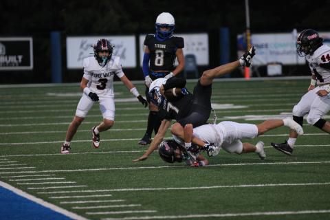 LOA quarterback Ike O'Neal fights for a first down in a game earlier this season. (FILE PHOTO)