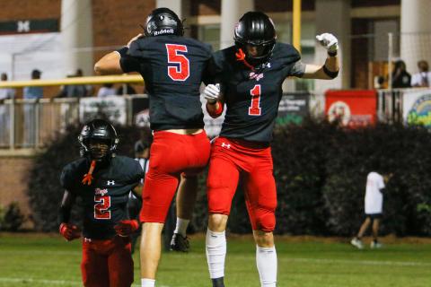 Morgan County quarterback Davis Strickland (5) and wide receiver Ty Tillery (1) celebrate after the two hooked up for a touchdown in a 55-12 region win over Rutland on Oct. 4. (LANCE MCCURLEY/Staff)