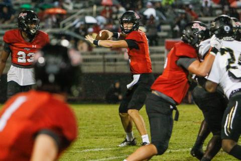 Morgan County quarterback Davis Strickland gets set to throw a pass in a game against Greene County in September. LANCE MCCURLEY/Staff