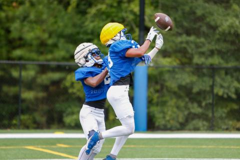 LOA’s Troy Evans (right) attempts to haul in a pass as teammate Corrion Jernigan tries to bat it down. LANCE McCURLEY/Staff